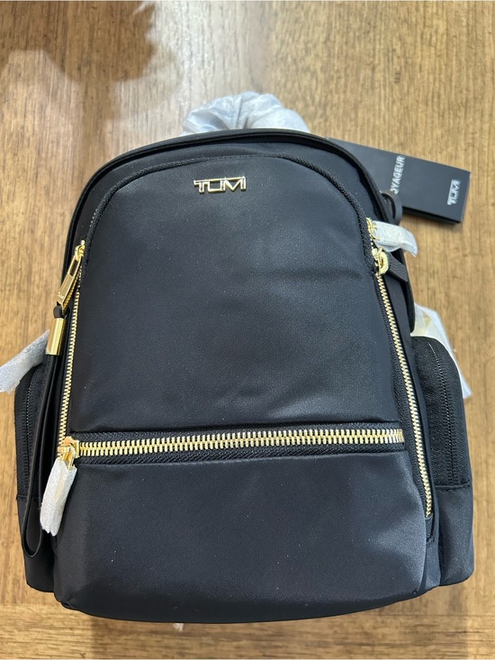 Tumi Handbags - NWT Tumi Voyageur Celina Small Black Backpack with Gold Hardware